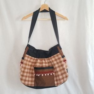 NWOT Lika J hobo shoulder bag flannel pink, black and brown patchwork tassel bag